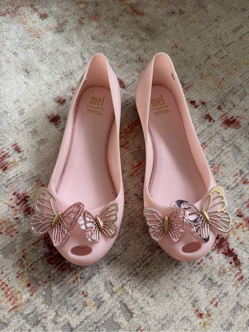 Mel by Melissa Light Pink Jelly Flats with Metallic Butterfly Accents